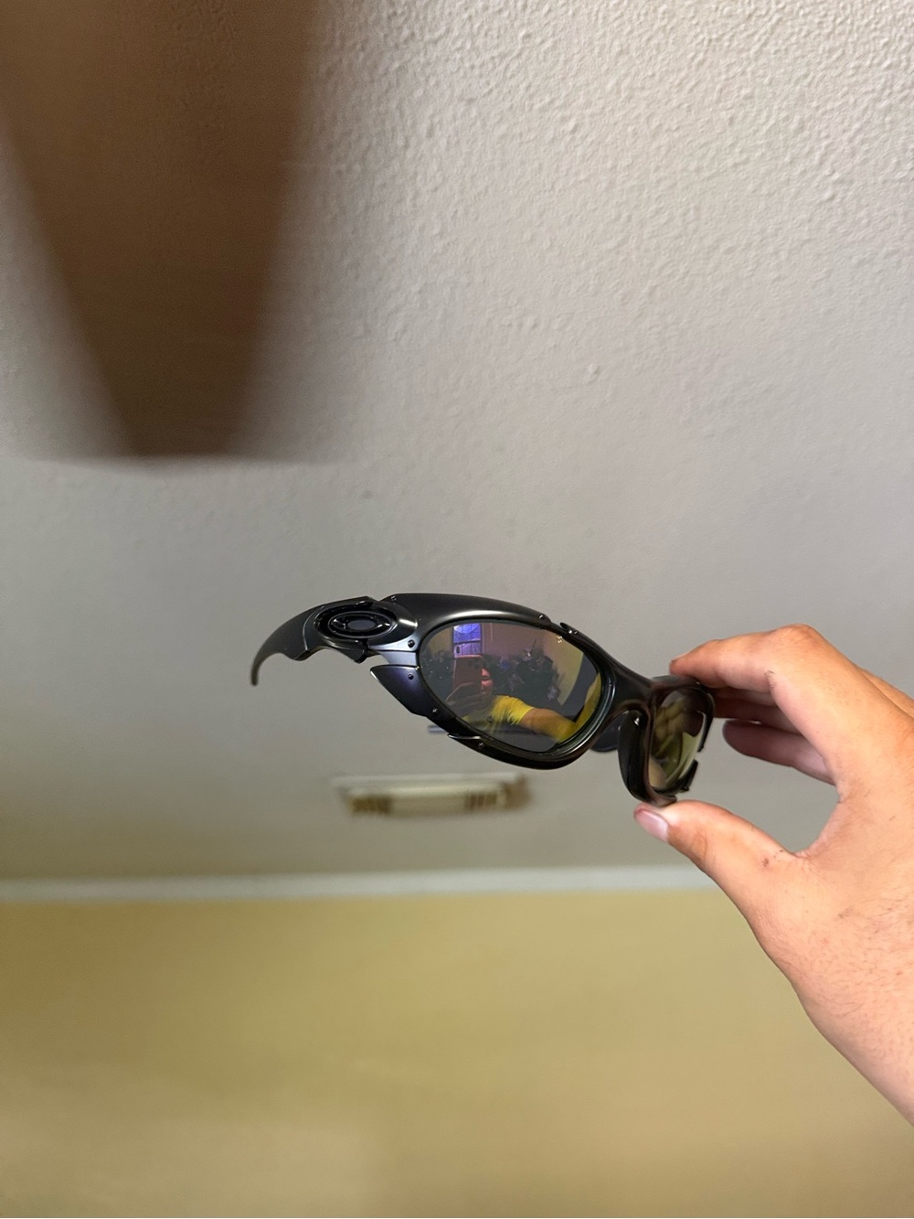 Oakley Black Sunglasses with Amber-Reflective Lenses